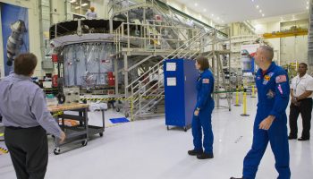 NASA astronaut candidate Kayla Barron and NASA astronaut Randy Bresnik looking at the European Service Module and Crew Module Adapter at Kennedy Space Center, 12 February. Credits:NASA–Kim Shiflett