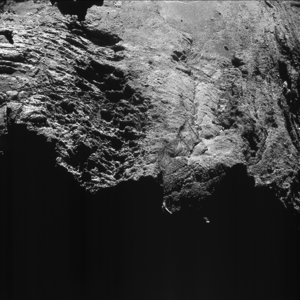 Enhanced NAVCAM image taken from a distance of 10.6 km to the centre of comet 67P/Churyumov-Gerasimenko on 8 August 2016. The image scale is 0.9 m/pixel and the image measures about 930 m across. Credits: ESA/Rosetta/NAVCAM – CC BY-SA IGO 3.0. 