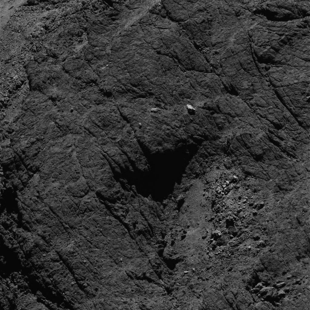OSIRIS narrow-angle camera image taken on 6 August 2016, when Rosetta was 8.7 km from the centre of Comet 67P/Churyumov–Gerasimenko. The scale is 0.15 m/pixel at the comet and the image measures about 307 m. Credit: ESA/Rosetta/MPS for OSIRIS Team MPS/UPD/LAM/IAA/SSO/INTA/UPM/DASP/IDA 