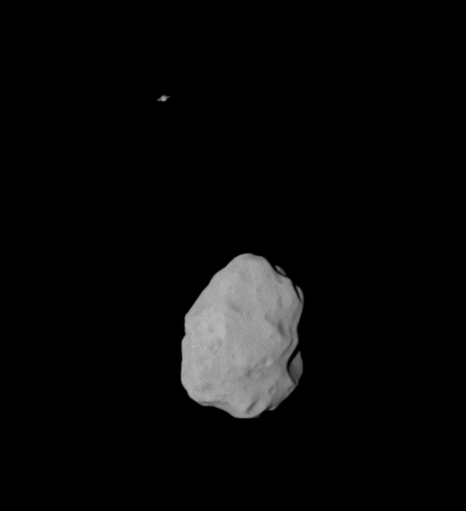 Asteroid (21) Lutetia with Saturn in the background seen from Rosetta in 2010. Credit: ESA/MPS for OSIRIS Team MPS/UPD/LAM/IAA/RSSD/INTA/UPM/DASP/IDA
