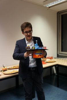 ROSINA PhD graduate Dr Sébastien Gasc (a chocolate addict) with the thesis: “Sensitivity and Fragmentation Calibration of the ROSINA Reflectron-type Time-of-Flight Mass Spectrometer” - with his PhD hat made by the ROSINA team. Image courtesy K. Altwegg. 