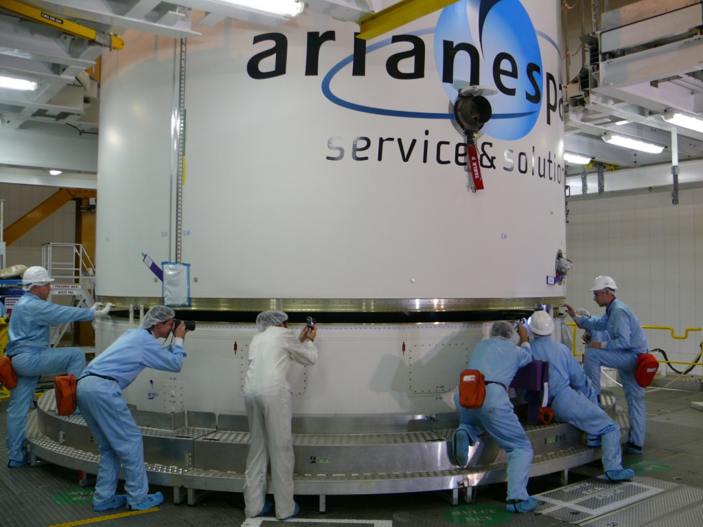 Ariane 5's aerodynamic fairing almost settled into place over ATV-3 Credit: ESA/A. Novelli