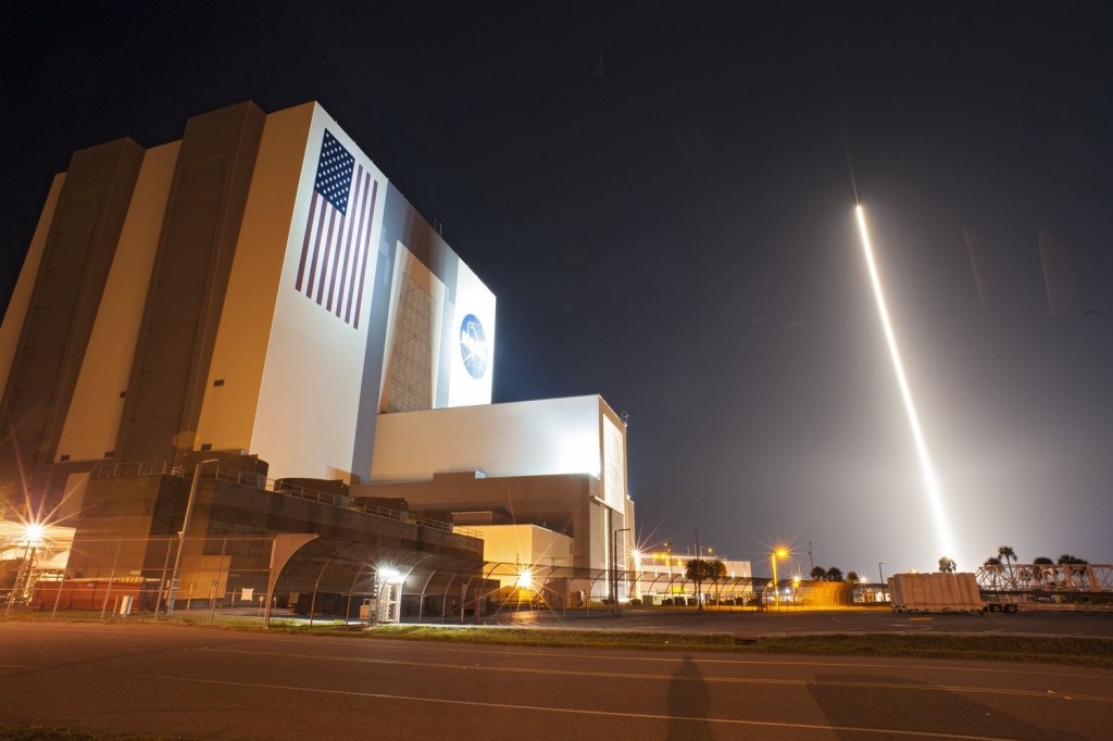 Tracking and Data Relay Satellite-K, streaks past the Vehicle Assembly Building and Launch Complex 39 at Kennedy Space Center after launching from Space Launch Complex 41 at 8:48 p.m. EST. Credit: NASA