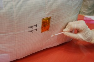 Checking cleanliness of ATV cargo bag. Credit: ESA