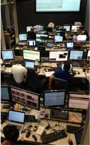 The Engineering Support Team; tonight the set up is augmented by the team responsible for this ATV-5 experiment. The EST is in room M27 and M34 (the two rooms are connected via camera). Credit: ESA