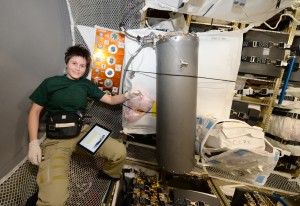 ESA astronaut Samantha Cristoforetti loading brine on ATV-5 , December 2014. Credits: ESA/NASA