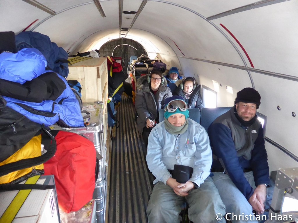 Part of the CryoVEx science team and all their equipment in the DC-3 used for airborne electromagnetic induction surveys. (Christian Haas)