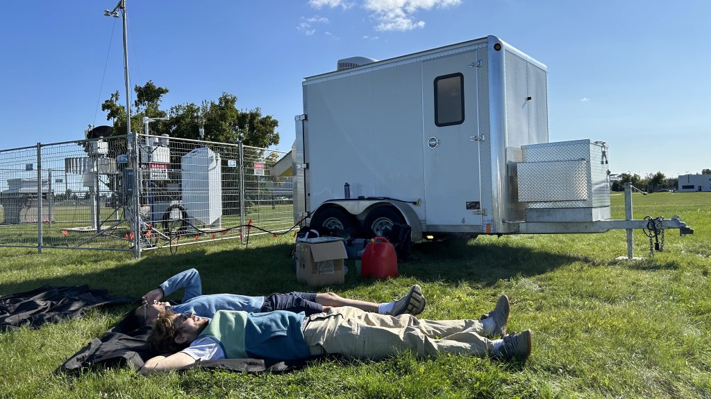 Benjamin Riot-Bretêcher and Lei Liu of McGill University doing a spot of cloud-gazing after installing instruments. (McGill University - Eve Bigras)