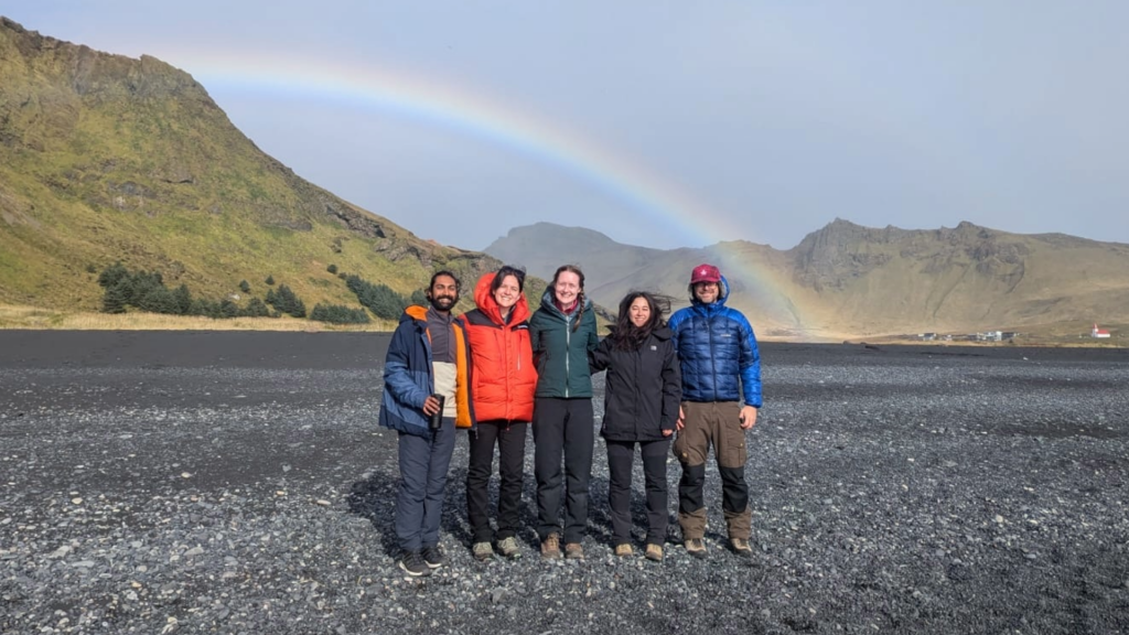 A rainbow over Iceland’s black sands, which stretch for many miles along its southern coastal region. (Credit: CPOM)