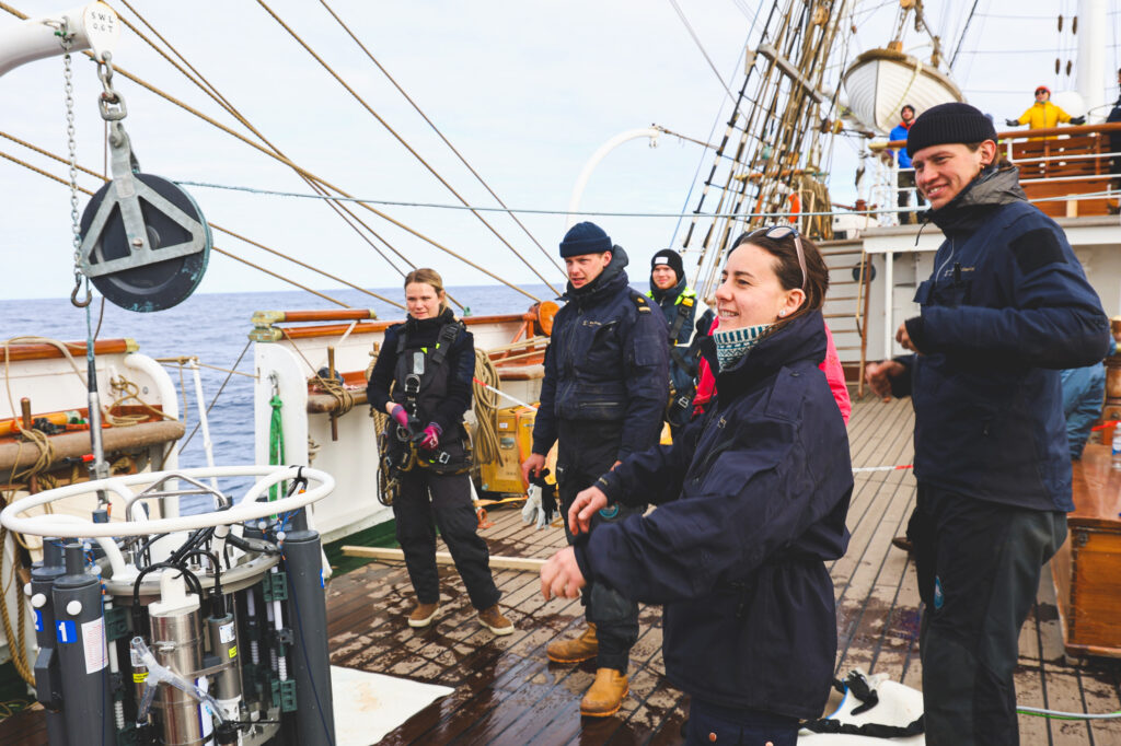 Deck crew waiting for deployment of the conductivity, temperature, density rosette. (Ocean Media Lab)