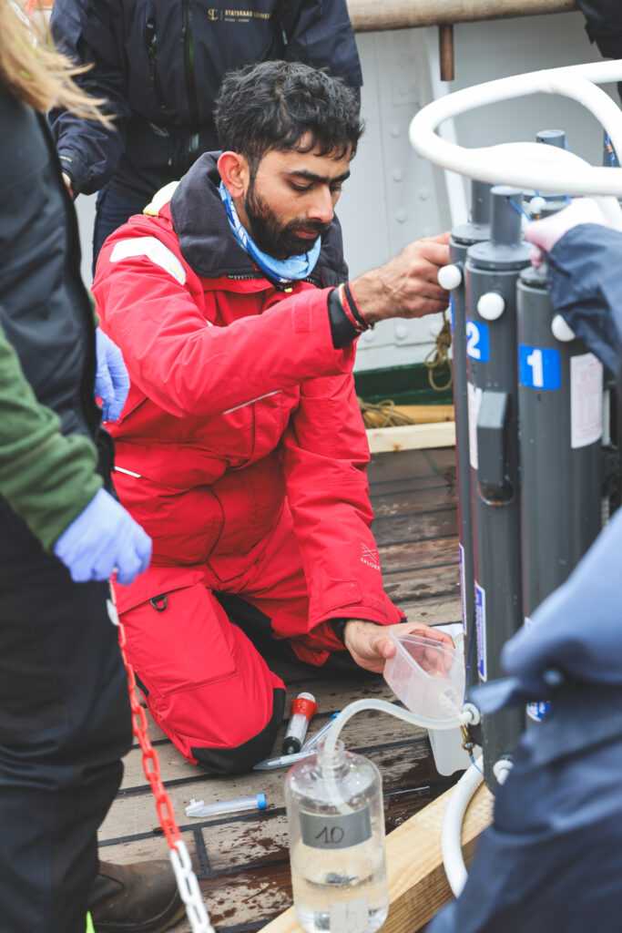 Brishan Kalyan, PhD candidate at the South African Environmental Observation Network and Nelson Mandela University, taking samples to measure nutrients. (Ocean Media Lab)