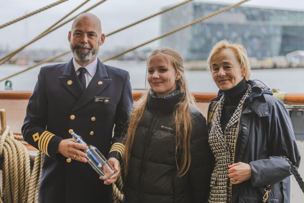 Captain Hiorth (left), a young ocean advocate (middle), and the Norwegian Ambassador to Iceland stand together after the official hand-over of the One Ocean Expedition’s message in a bottle. (Ocean Media Lab)