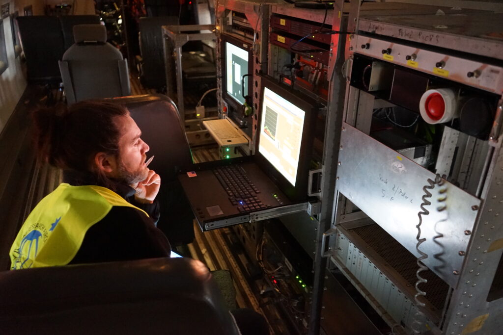 Analysing data on the Polar 5, during a flight. (Image credit: Jonas von Bismarck, ESA).
