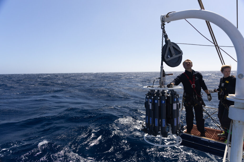 Crew David Jakobsen & student Louise Balmas ready to launch the CTD rosette. (Ocean Media Lab)