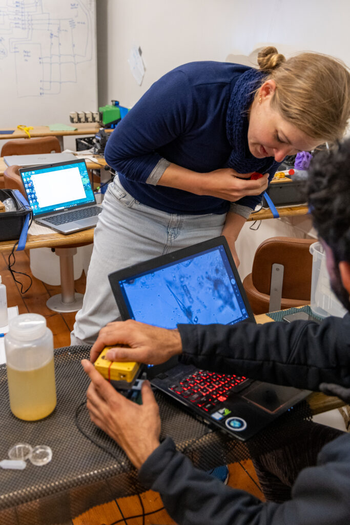 Saskia Ruehl (Digital Marine Scientist at Plymouth Marine Laboratory) and student Brishan Kalyan (South African Environmental Observation Network and Nelson Mandela University) looking at plankton with the curiosity microscope. (Ocean Media Lab)