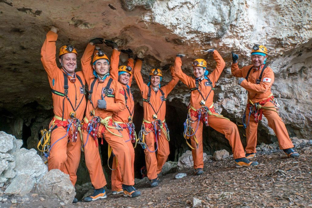 Last light before entering the caves. From left: Ricky Arnold, Ye Guangfu, Sergei Korsakov, Pedro Duque, Jessica Meir and Aki Hoshide. Credits: ESA–V. Crobu