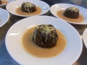 Leaf of Red cabbage with Indian spices stuffed with Foie Gras and Sultana, in a Beans Veloutée.