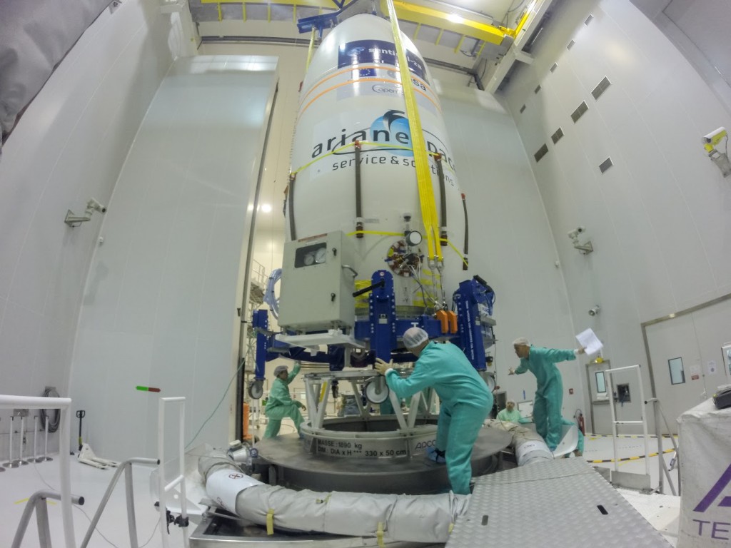 Carefully securing the assembly to the transportation platform. (ESA–M. Pedoussaut)
