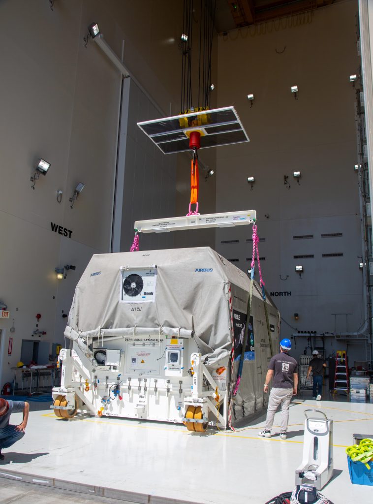 Lifting the EarthCARE container to load onto truck. (ESA)