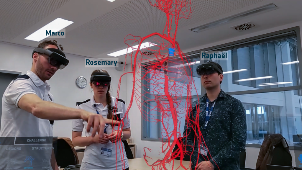 Marco, Rosemary and Raphael trying the HoloLens for medical anatomy training. Credits: ESA