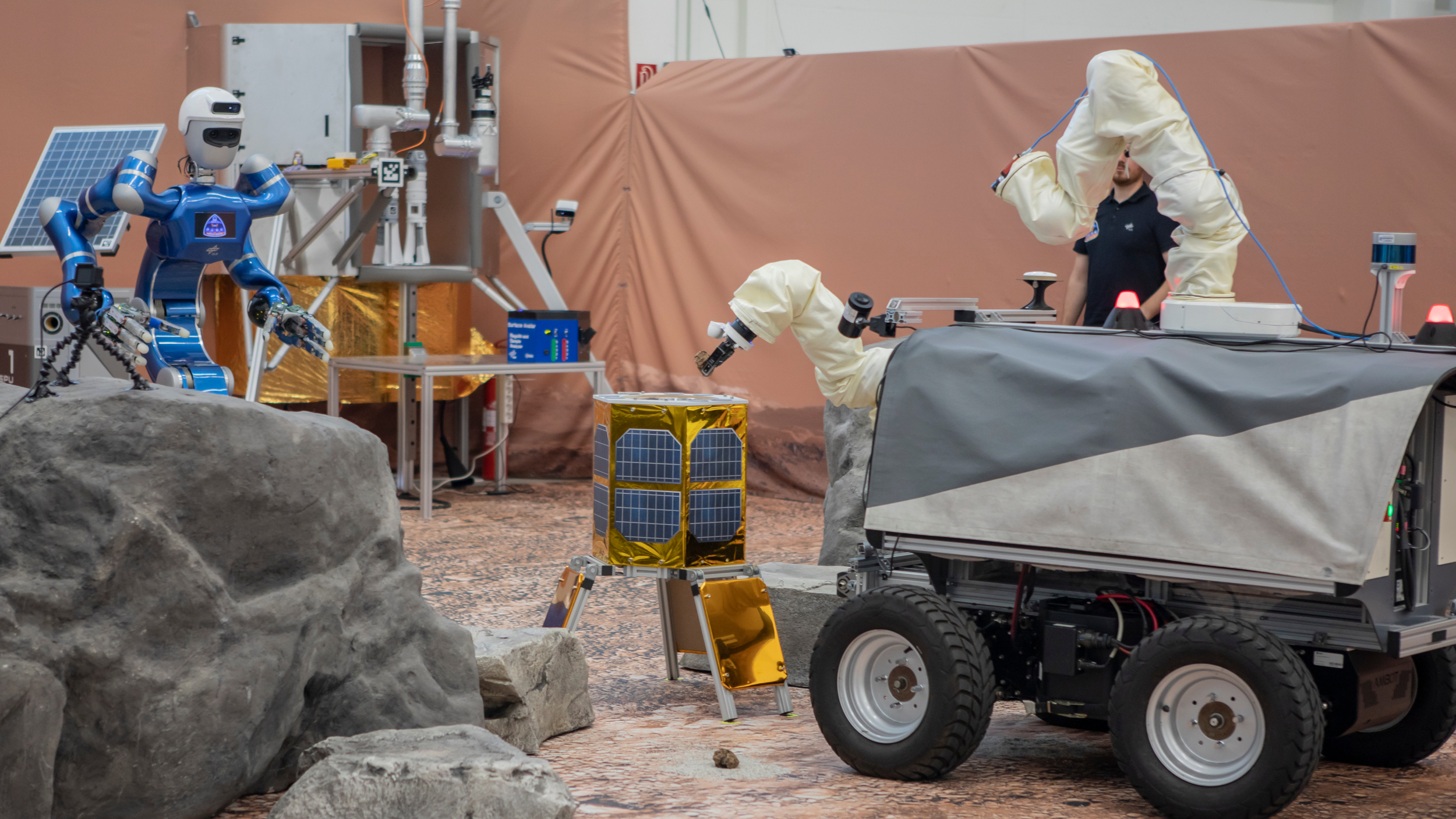 ESA’s Interact and DLR’s Rollin’ Justin exchanging samples during the experiment. Credit: ESA/DLR