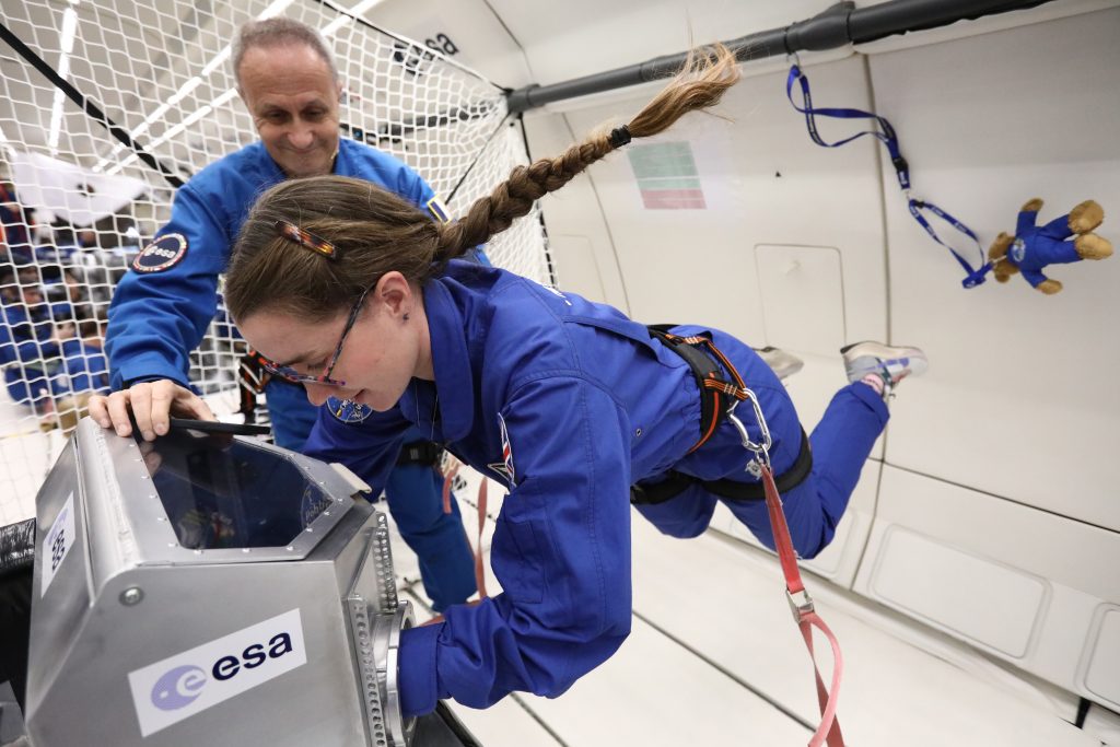 ESA astronaut Rosemary Coogan working with the glovebox during a parabolic flight. Credits: Novespace