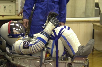 Claudie strapped into her chair before launch on Soyuz for the Andromède mission to the International Space Station (21 October 2001). Credits: ESA/CNES 2001-S. Corvaja