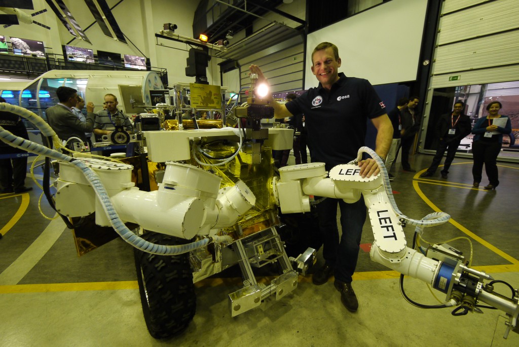 Andreas with Supvis-E experiment rover Eurobot before his iriss flight. Credits: ESA–J. Harrod CC BY SA IGO 3.0