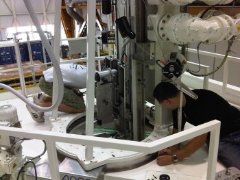 Late cargo loading: The operator stands on the platform inside the ring Credit: ESA/C. Beskow