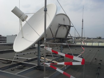 Two parabolic dishes are located on the roof of the ATV integration building at Astrium/Bremen. One is pointed toward NASA's relay satellite (TDRS6 - located near south America), and one is pointed toward ESA's Artemis. Credit: Astrium