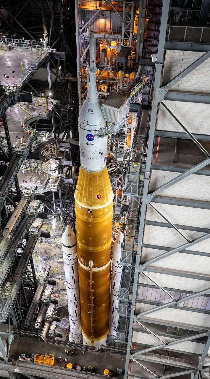 SLS, the mega Moon rocket used for Artemis missions, seen inside the Vehicle Assembly Building before the launch of Artemis 1. Credit: NASA/Glenn Benson