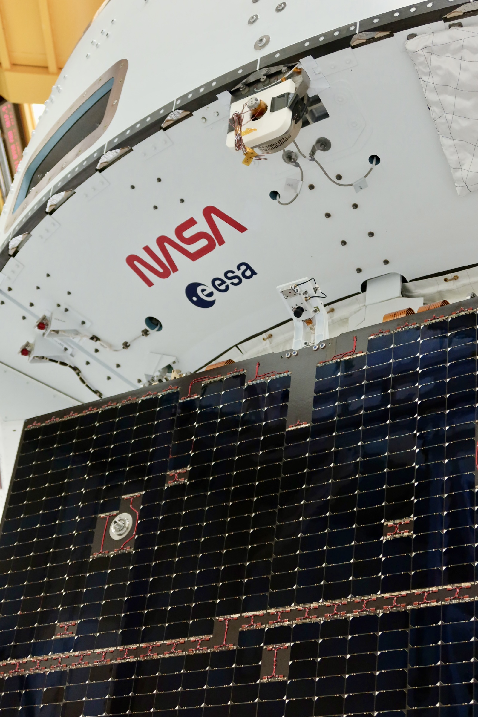 Solar arrays installed on NASA's Artemis II Orion spacecraft inside the Operations and Checkout Building at NASA's Kennedy Space Center, early March 2025. Credit: Lockheed Martin