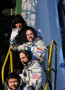Expeditions 30 and 31 crew members greeting audience at the launch pad