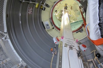 View from inside ATV looking up at the hatch. The operator was ready for the first cargo bag. Credit: ESA