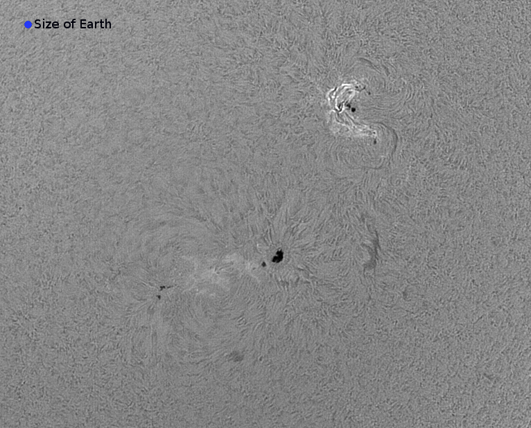 Sunspots imaged in H-alpha light prior to flare activity in September 2017 with a blue dot showing the size of Earth for comparison. Region 2673 is visible at top right. This region can be seen to be magnetically complex (twisty) and dense/energetic. Credit: ESA/E.Serpell