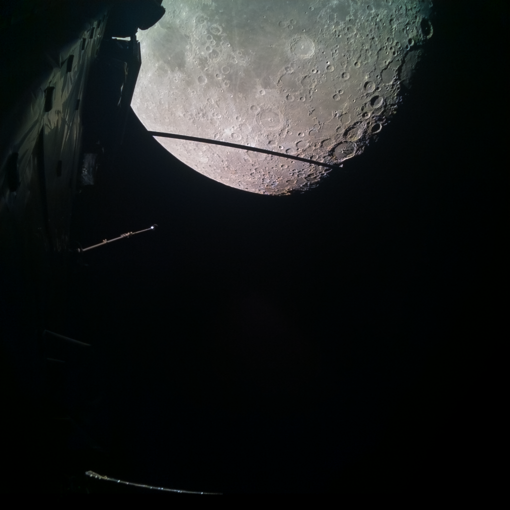 View of our cratered Moon at the top of the image, as captured by the Juice monitoring camera 1 (JMC1) at 23:25 CEST on 19 August 2024, soon after Juice made its closest approach to the Moon. On the left side of the image we see parts of the spacecraft itself.