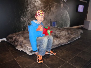 A young visitor meets ESA Kids mascot 'Paxi' and poses for a photo with the Philae lander (1:4) model. Image courtesy Rosita Suenson.