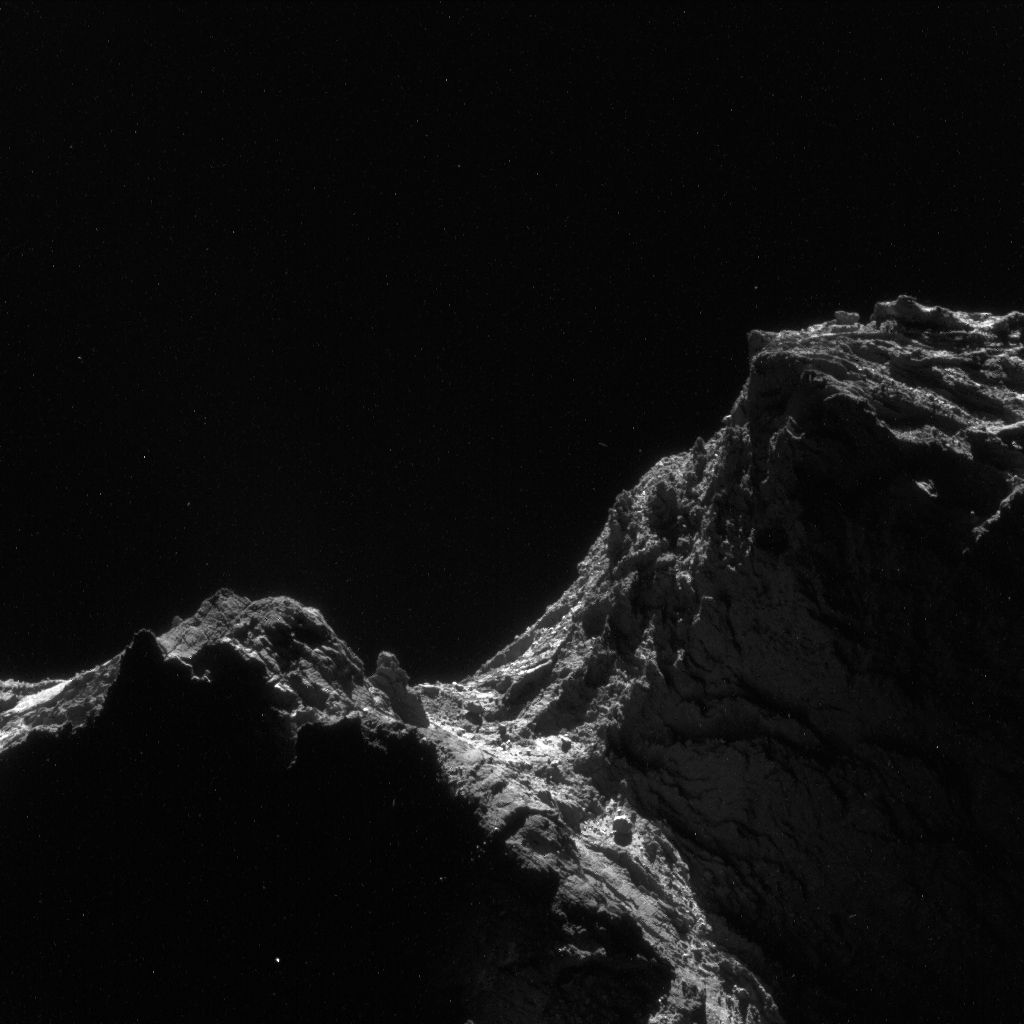 Enhanced NAVCAM image of Comet 67P/C-G taken on 24 April 2016, 28 km from the nucleus. The scale is 2.4 m/pixel and the image measures 2.4 km across. Credits: ESA/Rosetta/NAVCAM – CC BY-SA IGO 3.0.