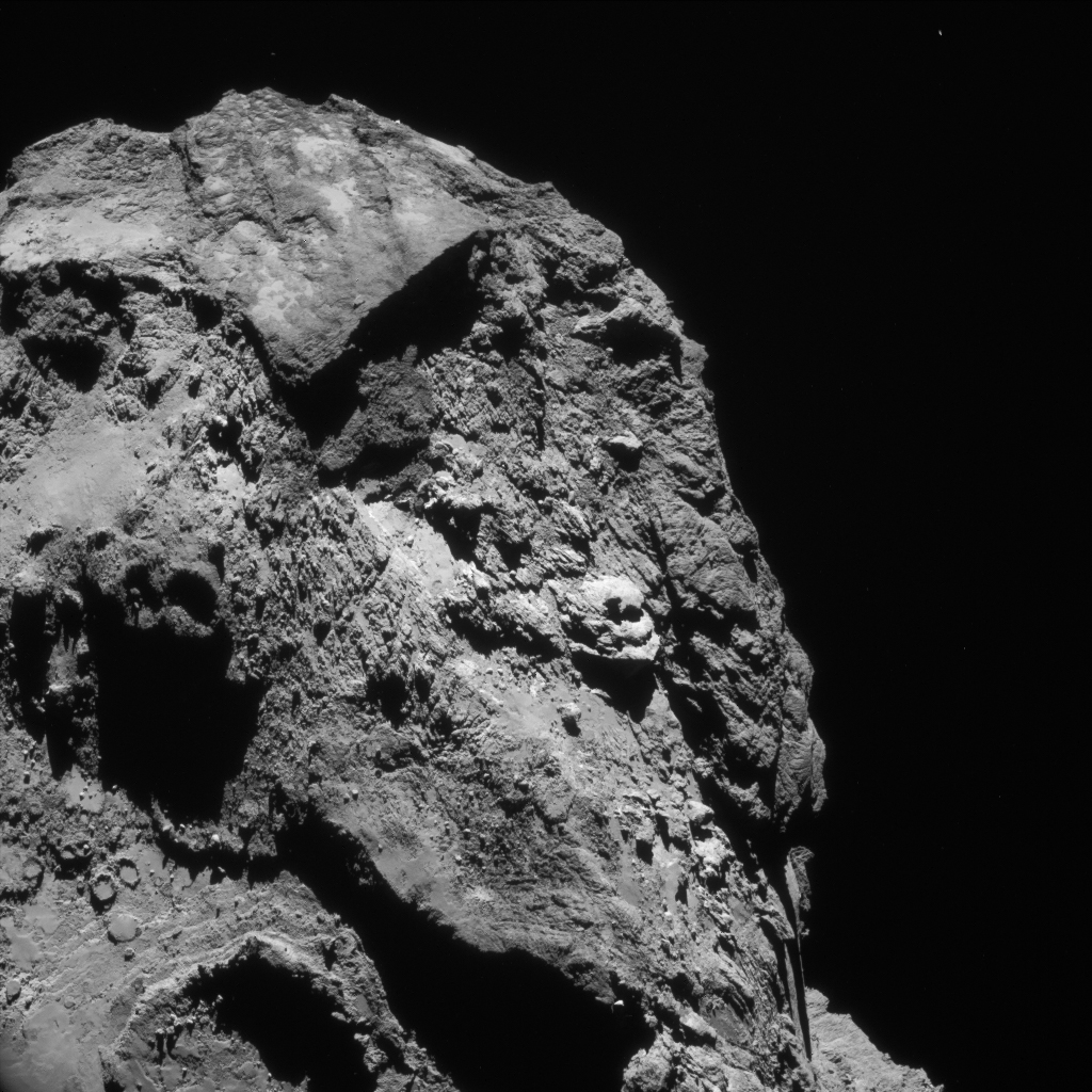 Enhanced single-frame NAVCAM view of Comet 67P/C-G on 13 June 2016, taken from a distance of 28.5 km. The image scale is 2.4m/pixel and the image measures 2.5km across. Credits: ESA/Rosetta/NavCam – CC BY-SA IGO 3.0 