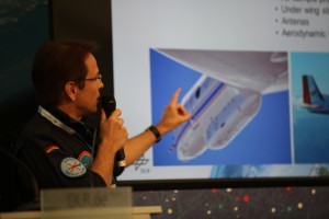 Test pilot Stefan Gemsa points out research equipment on a Gulfstream that could have affected aircraft performance