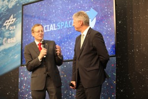 Jan Woerner and Thomas Reiter on stage at SocialSpace in Cologne.