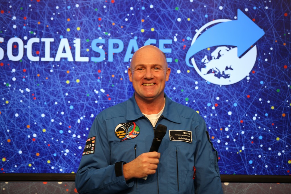 Andrew Kuipers smiling on stage at SocialSpace