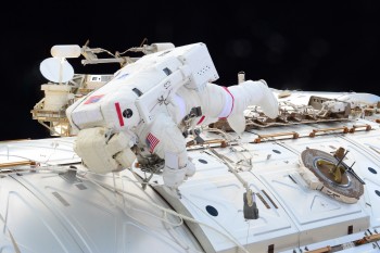 Spacewalk to move the Mobile Transporter. Credits: ESA/NASA