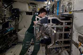 ESA astronaut Samantha Cristoforetti working with Biolab in Columbus space laboratory. Credits: ESA/NASA