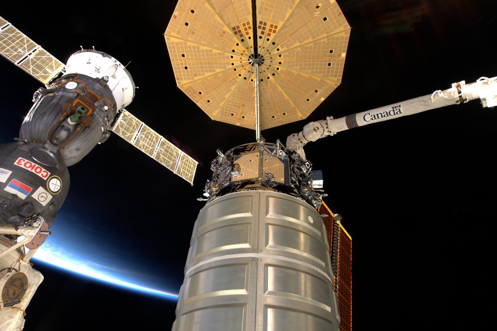 Cygnus ready for departure with Canadarm already attached. Credits: ESA/NASA