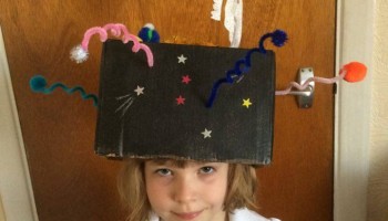 My daughter Eva had to make a hat for a school project. She choose to do the solar system and a rocket with a drawing of Tim in it, and wanted to show him!