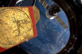 Mappa Mundi floating inside Cupola with Earth in the background. Credits: ESA/NASA