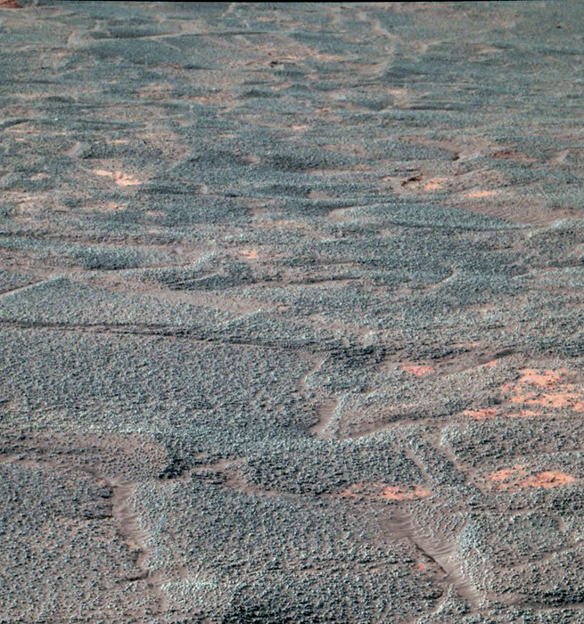 This false-colour image of the interior of 'Endurance Crater' on Mars was collected on 4 August 2004 by NASA's Mars Exploration Rover Opportunity. It was relayed to Earth via ESA's Mars Express. The image, taken with the Rover's panoramic camera, was relayed to Earth by ESA's Mars Express together with other scientific data. Three separate frames, taken through red, green and blue filters, were combined to produce this colour image. NASA/JPL/Cornell
